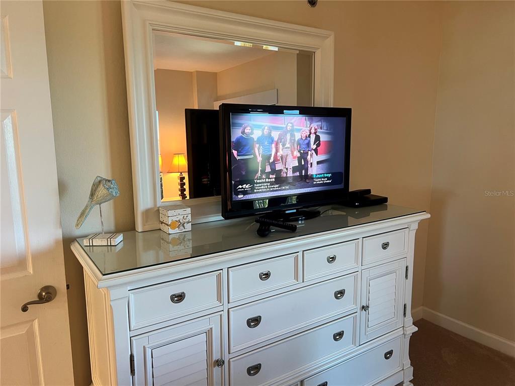 1001 Point Of Rocks Road, Unit 412 Sarasota, FL 34242 - Photo 15 of 43 a room with mirror and window