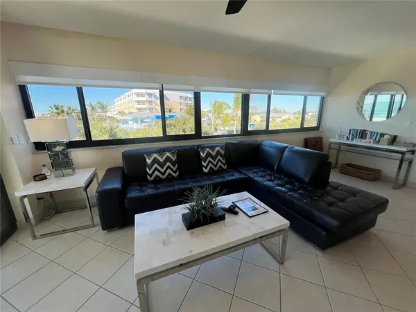 a living room with furniture and a window