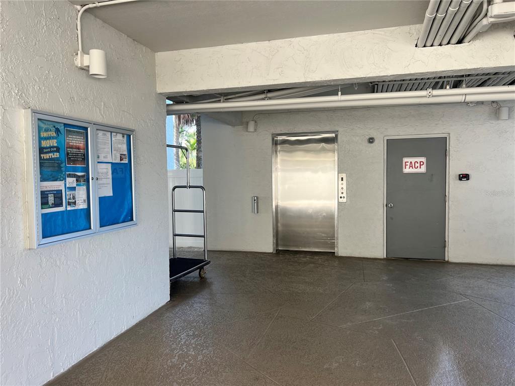 1001 Point Of Rocks Road, Unit 412 Sarasota, FL 34242 - Photo 39 of 43 a view of a livingroom with furniture and staircase