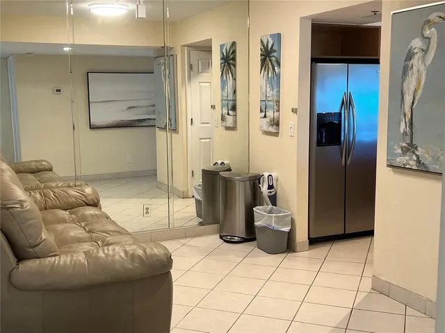 a living room with a couch and a stove top oven