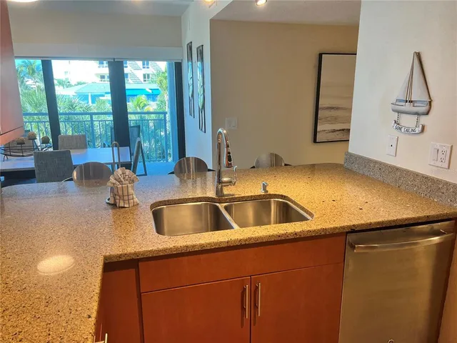 a kitchen with a sink and a window