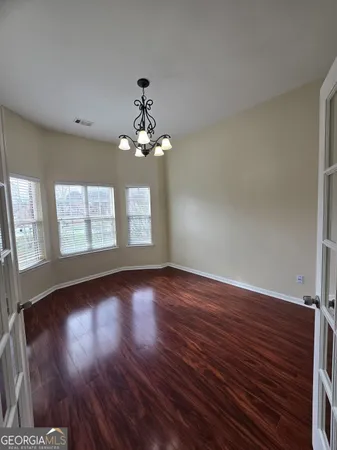 a kitchen with stainless steel appliances granite countertop a sink refrigerator stove and microwave