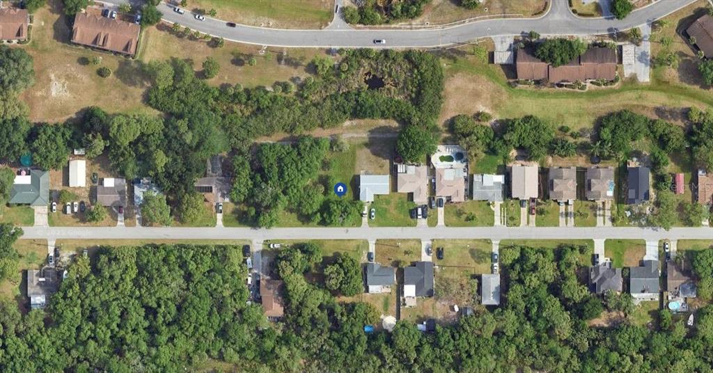 8165 Gulf Way Hudson, FL 34667 - Photo 4 of 6 a view of a multi story building