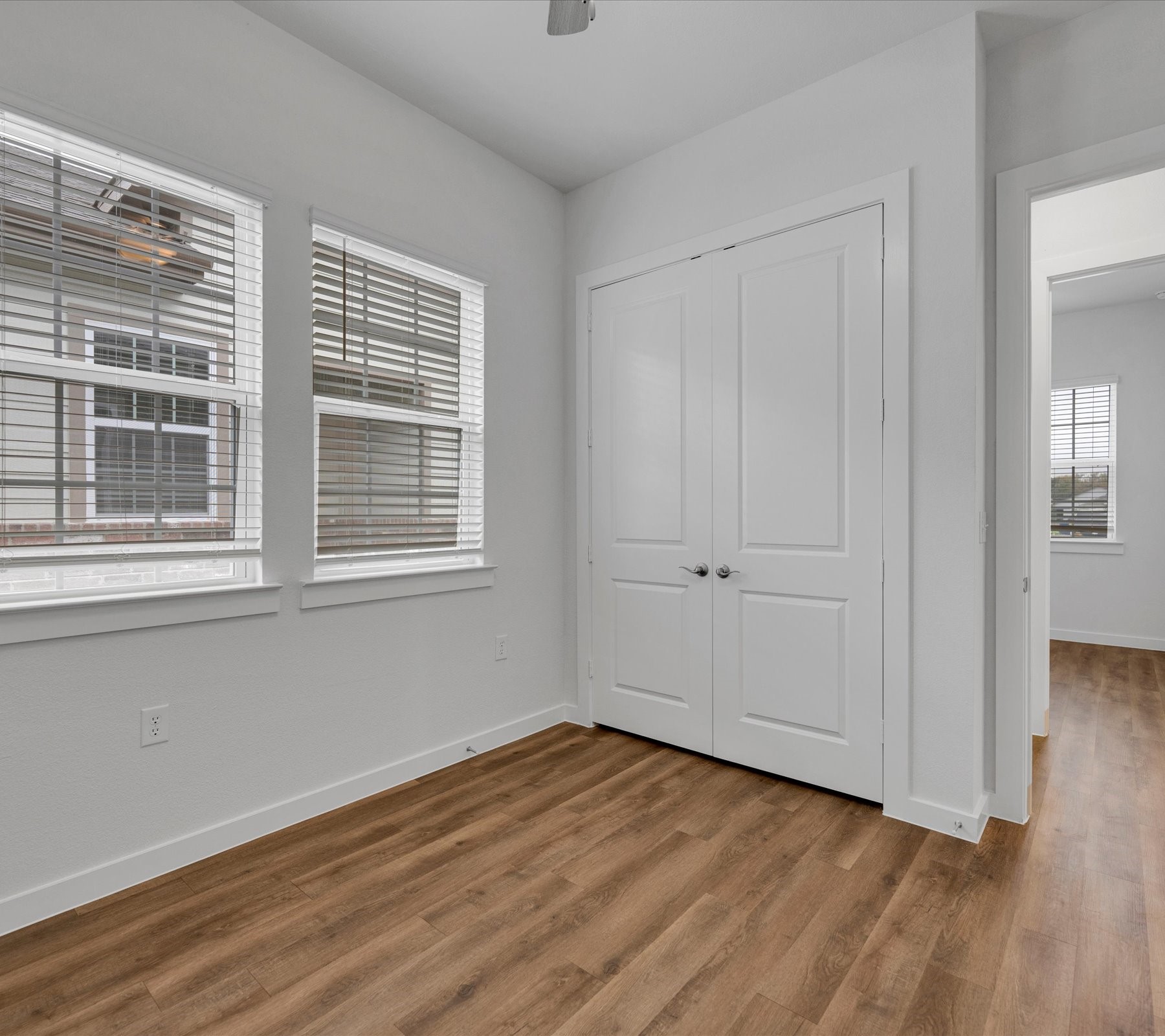 2709-512 Rockhill Road McKinney, TX 75072 - Photo 4 of 21 a view of empty room with wooden floor and fan