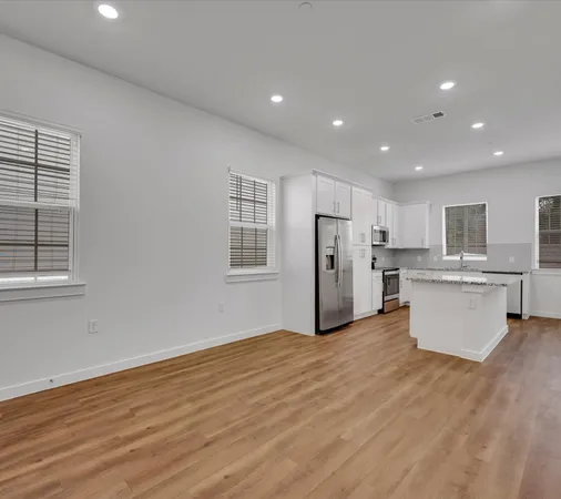 a view of kitchen with wooden floor