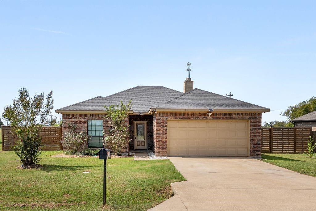 1002 Baker Lane Mabank, TX 75147 - Photo 1 of 1 a front view of a house with a yard