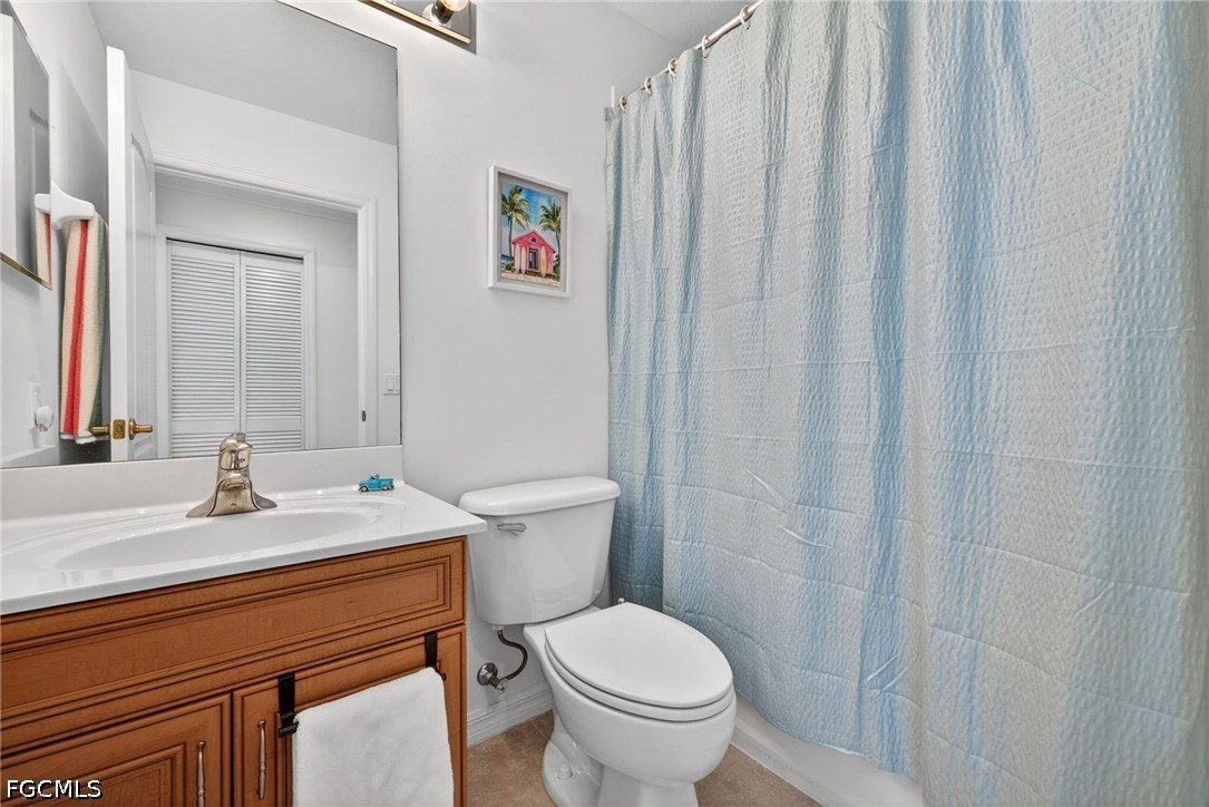 8251 Pathfinder Loop, Unit 621 Fort Myers, FL 33919 - Photo 22 of 30 a bathroom with a sink a toilet and shower