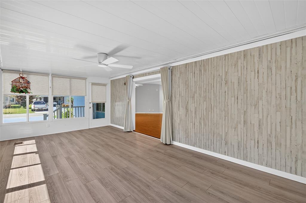 3024 Manatee Road Tavares, FL 32778 - Photo 15 of 39 wooden floor in an empty room with a window