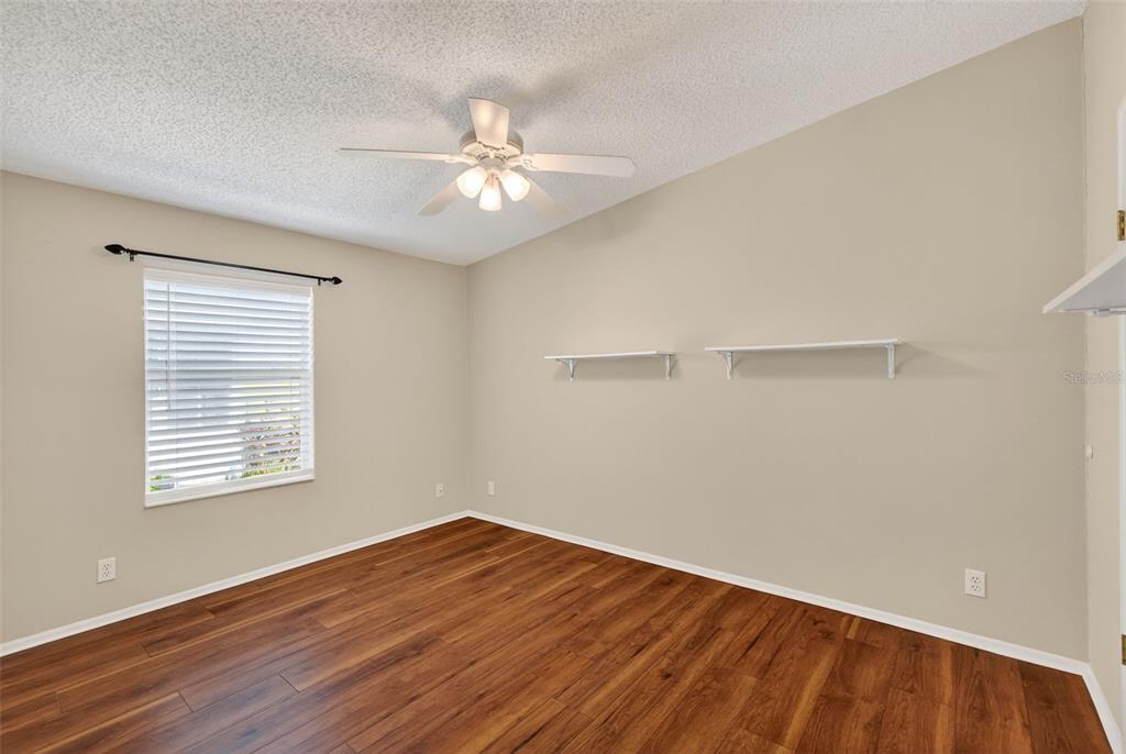 3024 Manatee Road Tavares, FL 32778 - Photo 20 of 39 a view of a room with wooden floor and fan