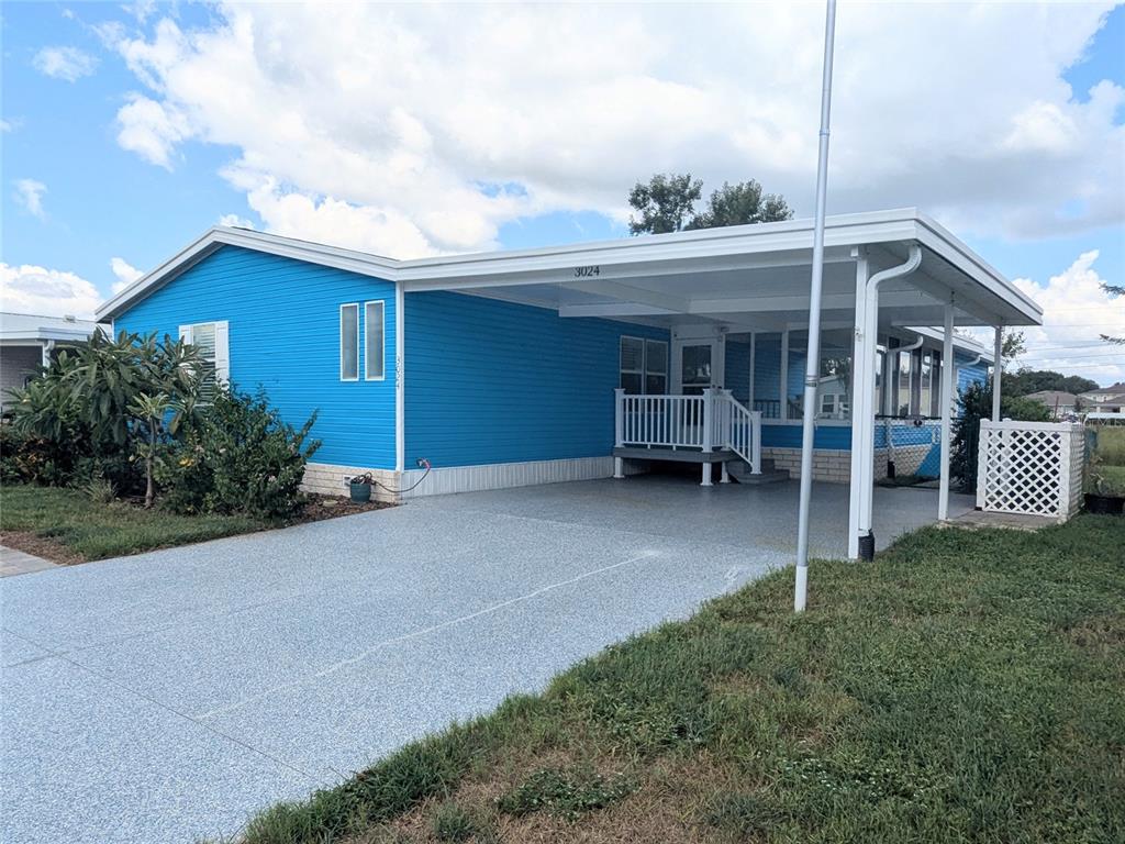 3024 Manatee Road Tavares, FL 32778 - Photo 2 of 39 a view of a house with porch