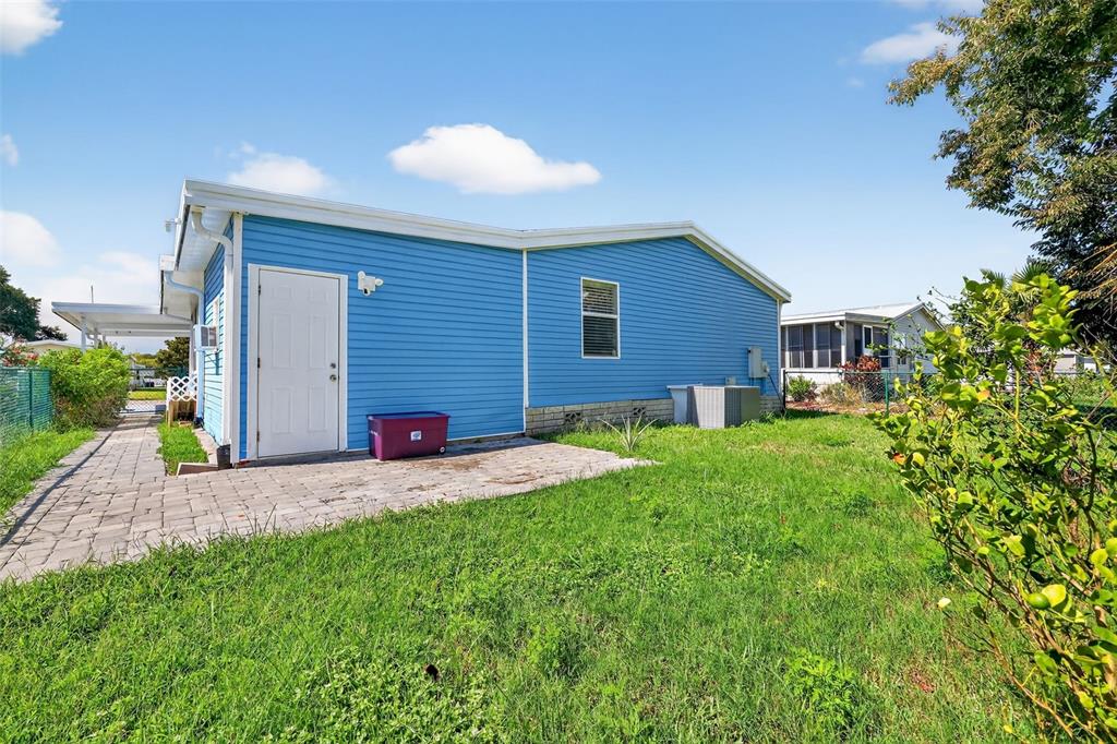 3024 Manatee Road Tavares, FL 32778 - Photo 26 of 39 a view of a house with a yard and garage