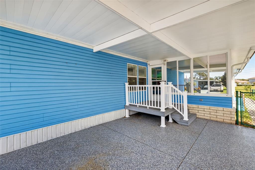 3024 Manatee Road Tavares, FL 32778 - Photo 3 of 39 a view of a house with a deck and a yard