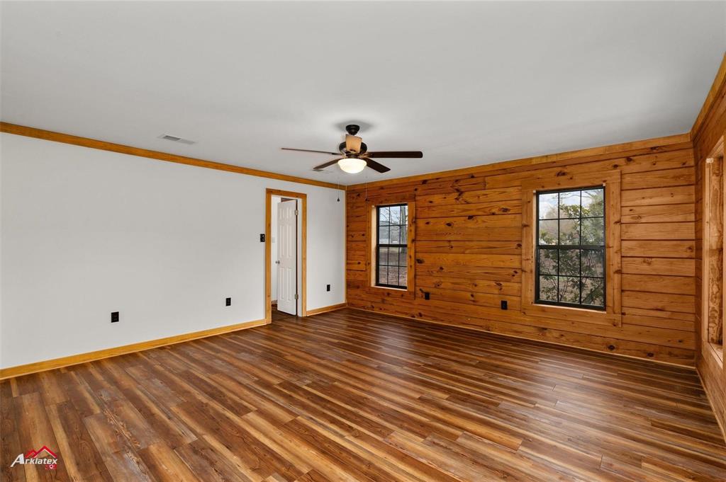 2912 Jamerson Road Haughton, LA 71037 - Photo 14 of 37 a view of an empty room with a window and wooden floor