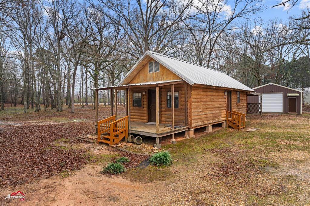 2912 Jamerson Road Haughton, LA 71037 - Photo 21 of 37 a house with trees in front of it