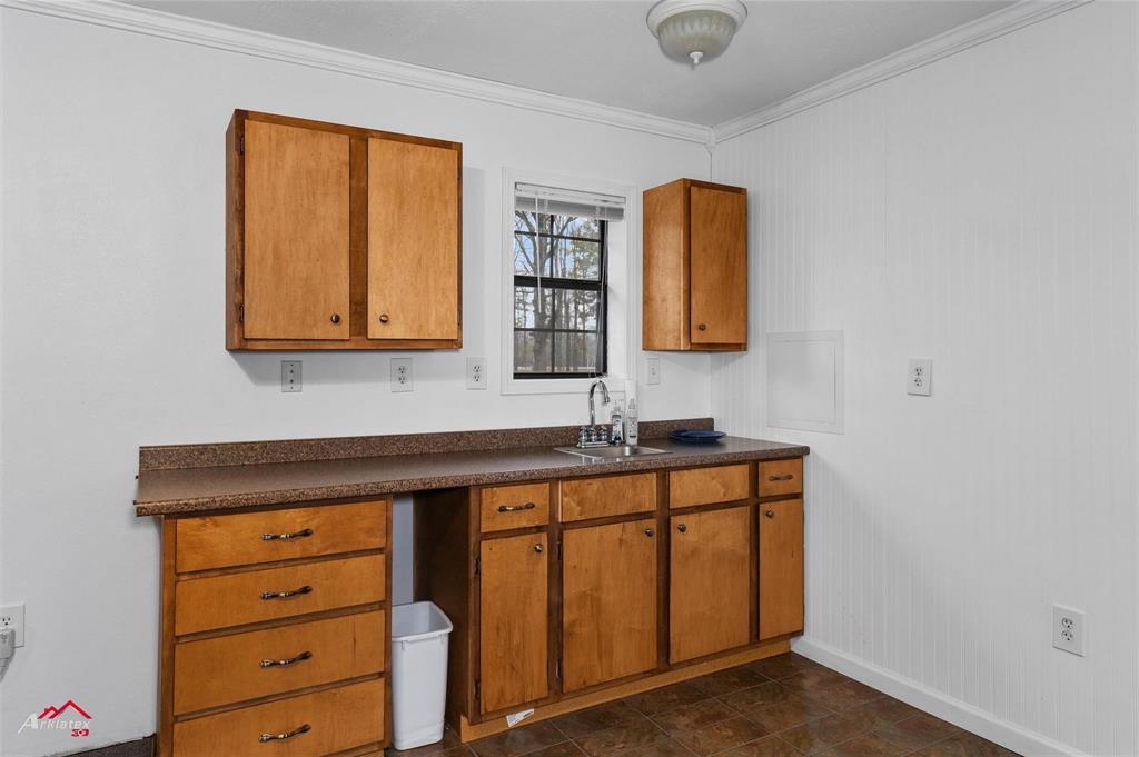 2912 Jamerson Road Haughton, LA 71037 - Photo 24 of 37 a utility room with mirror and a wooden floor