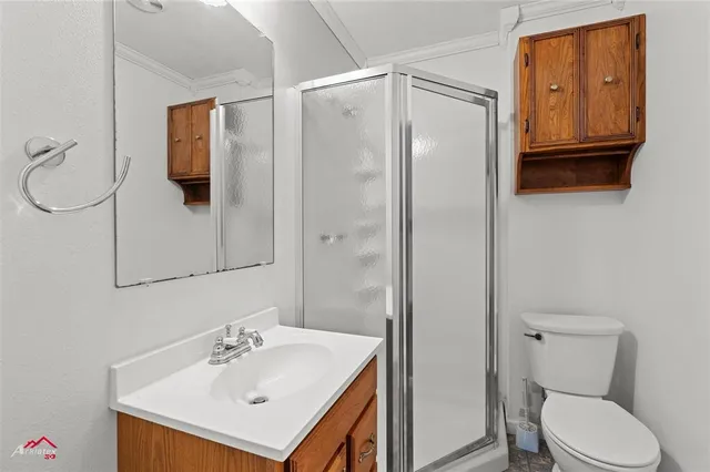 a bathroom with a sink toilet and mirror