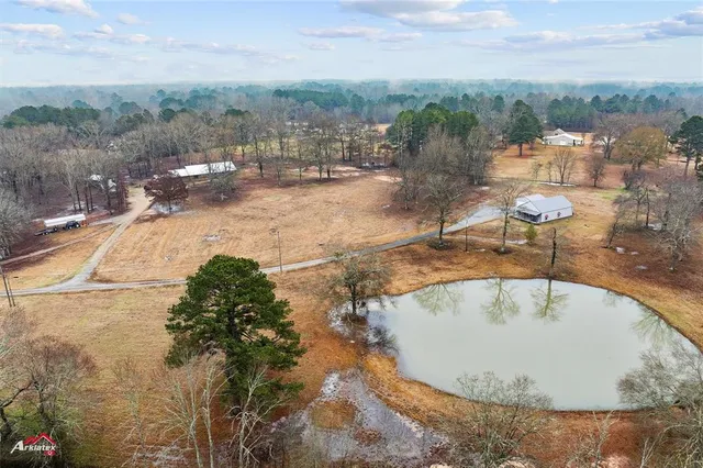 a view of a swimming pool with a yard
