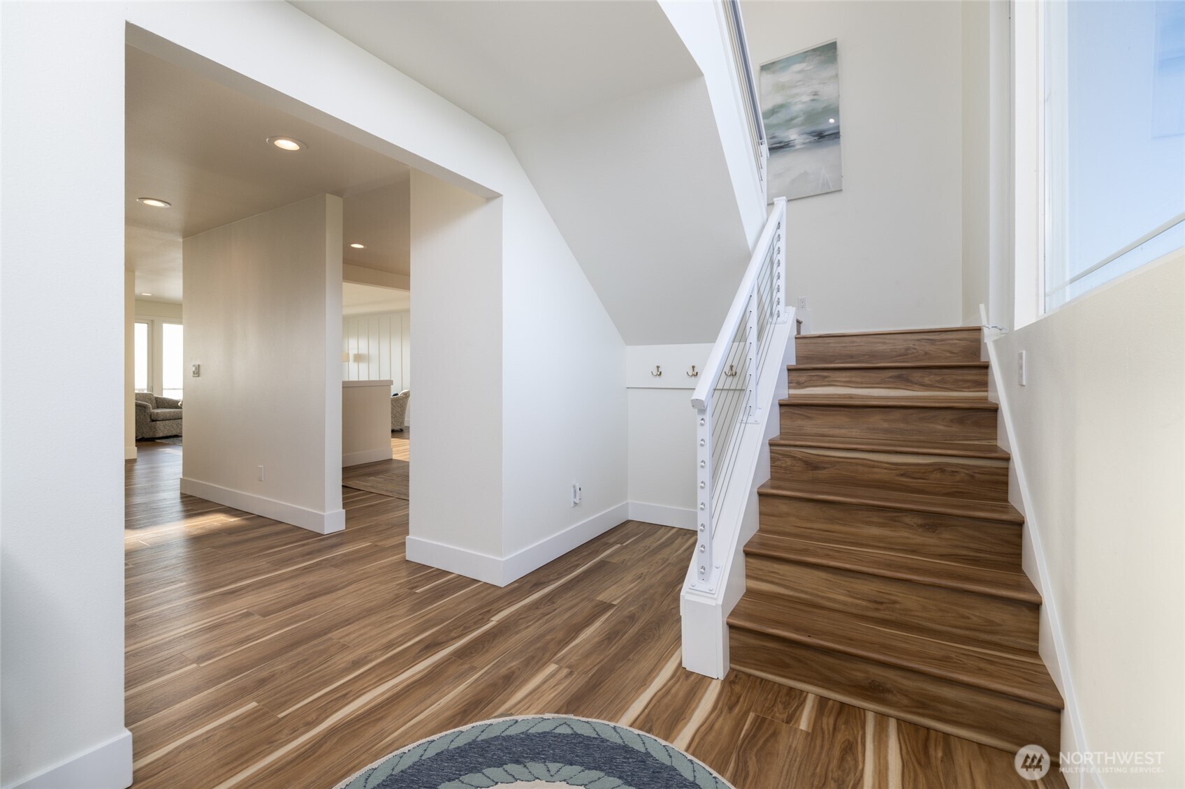 2575 West Beach Road Oak Harbor, WA 98277 - Photo 14 of 40 a view of entryway and hall with wooden floor