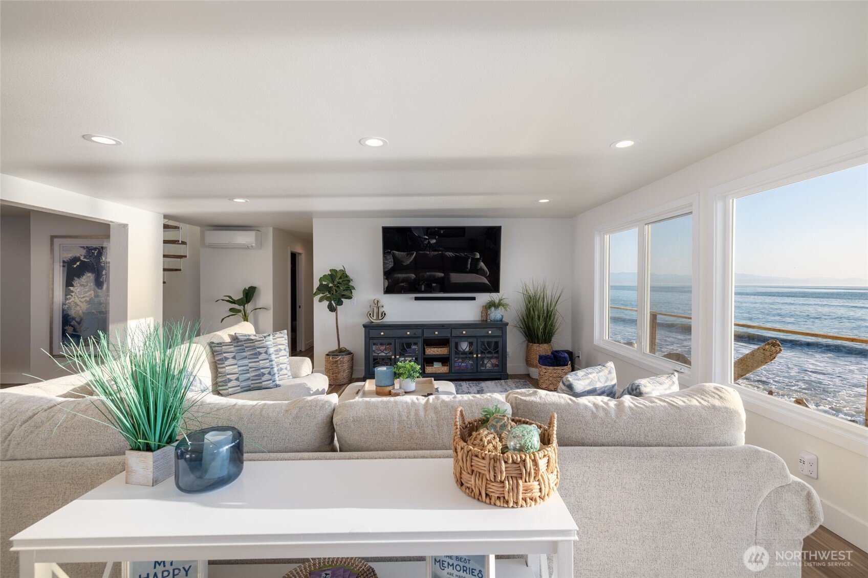 2575 West Beach Road Oak Harbor, WA 98277 - Photo 17 of 40 a living room with fireplace furniture and a potted plant