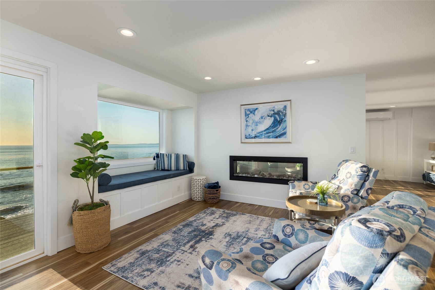2575 West Beach Road Oak Harbor, WA 98277 - Photo 19 of 40 a living room with furniture and a fireplace