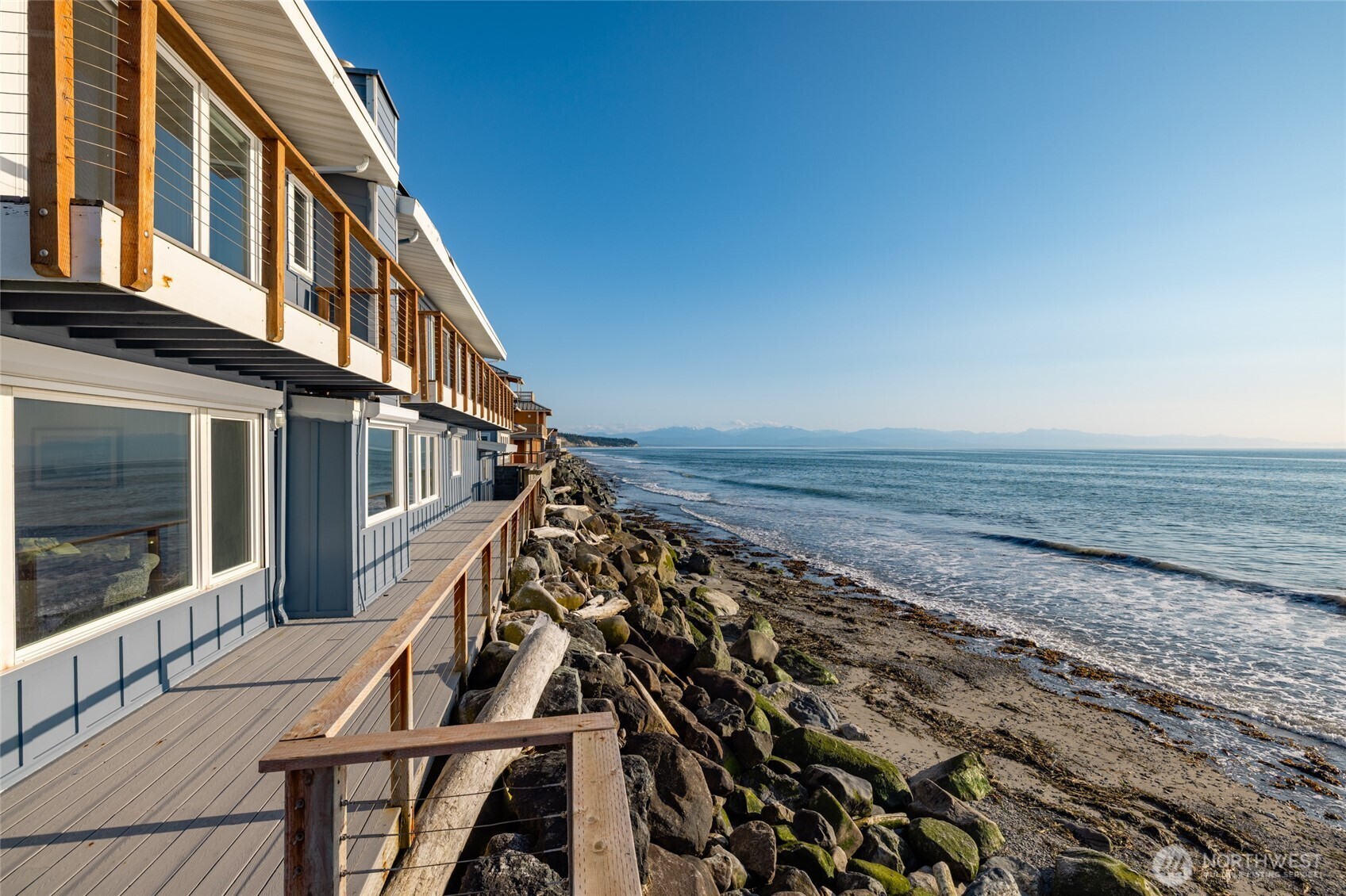 2575 West Beach Road Oak Harbor, WA 98277 - Photo 2 of 40 a view of an ocean with a building