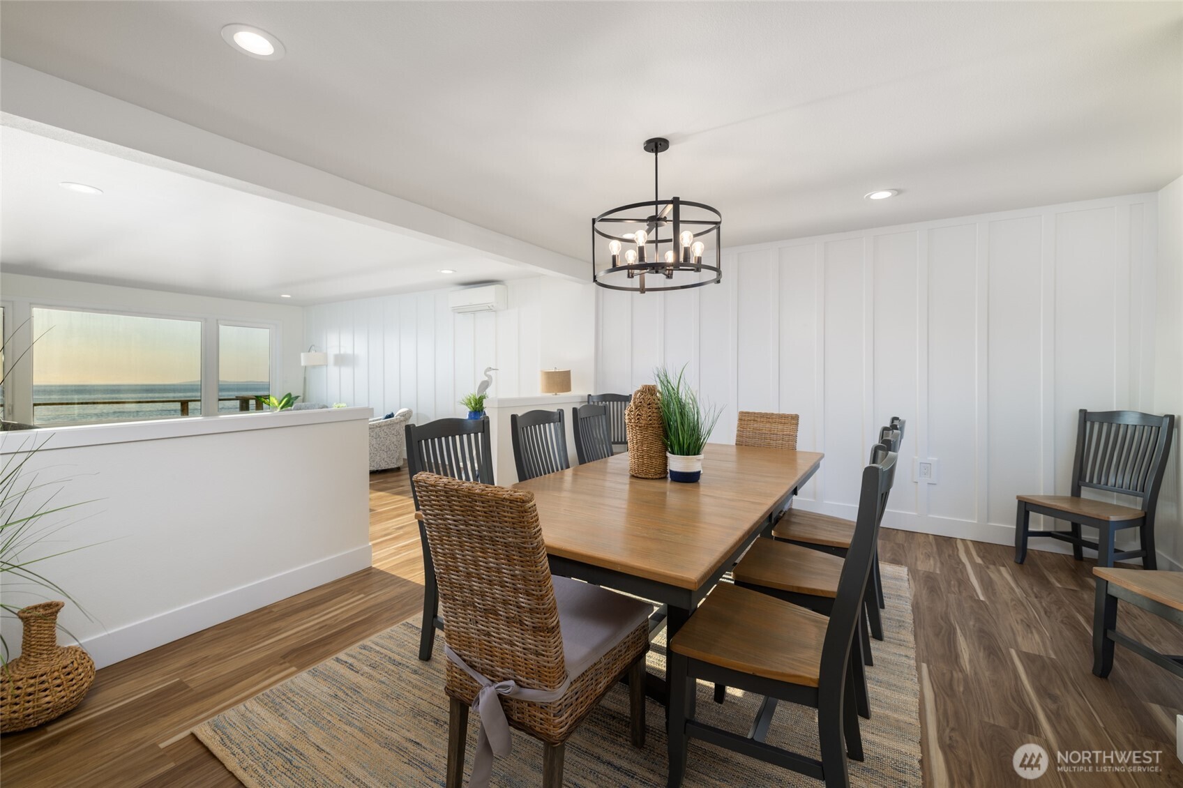2575 West Beach Road Oak Harbor, WA 98277 - Photo 21 of 40 a view of a dining room with furniture wooden floor and chandelier