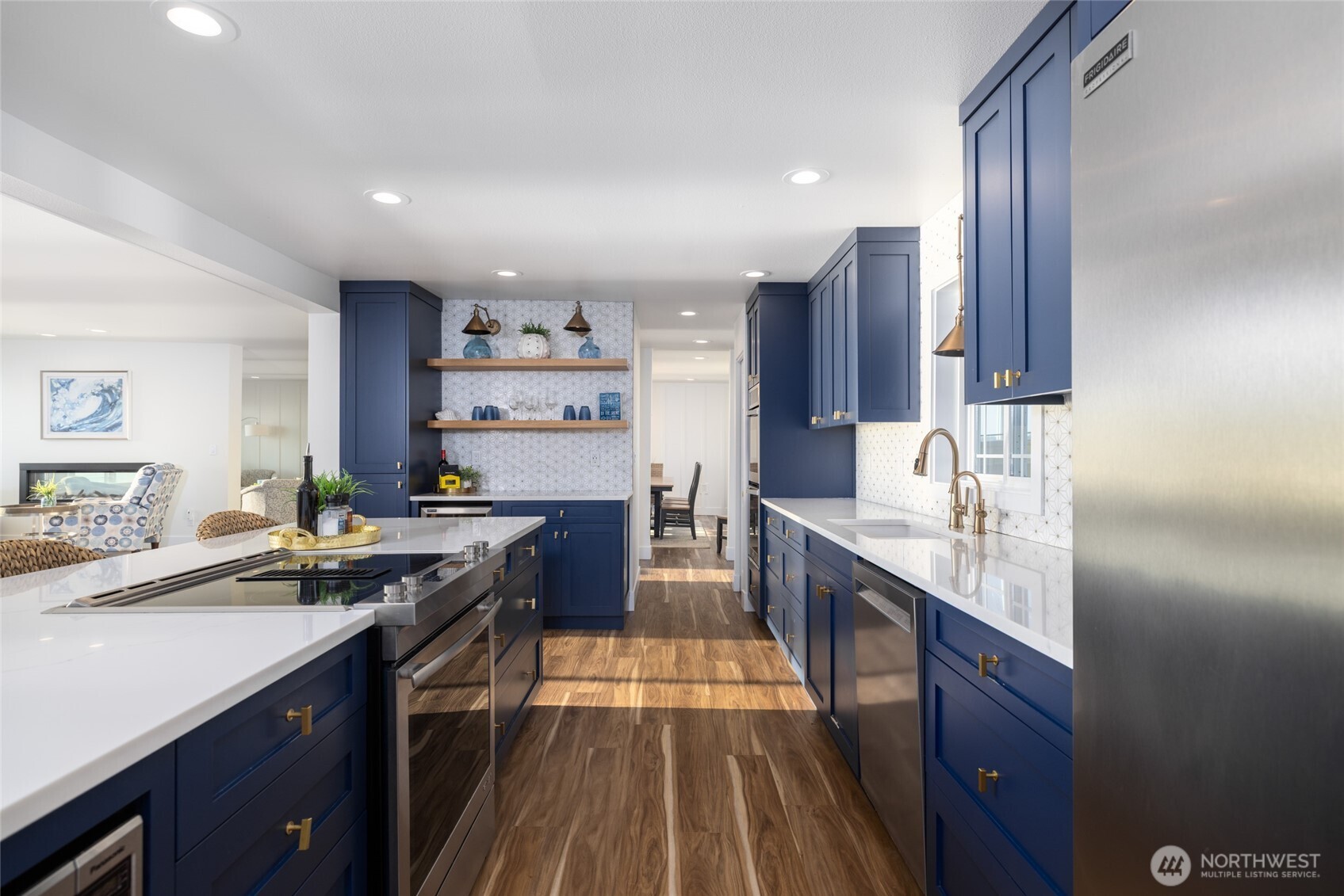 2575 West Beach Road Oak Harbor, WA 98277 - Photo 23 of 40 a kitchen with stainless steel appliances granite countertop a sink stove and refrigerator