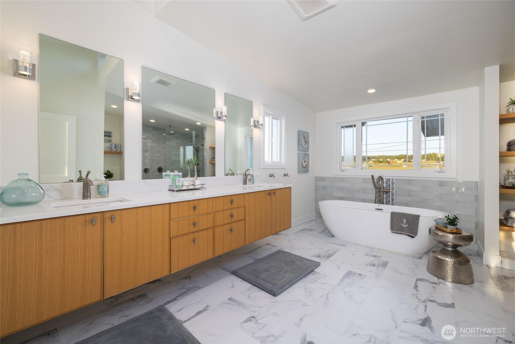 2575 West Beach Road Oak Harbor, WA 98277 - Photo 28 of 40 a large bathroom with a large tub sink and window