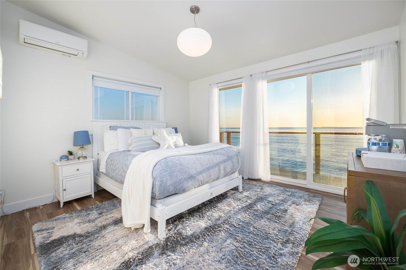 2575 West Beach Road Oak Harbor, WA 98277 - Photo 31 of 40 a bedroom with a bed and large window