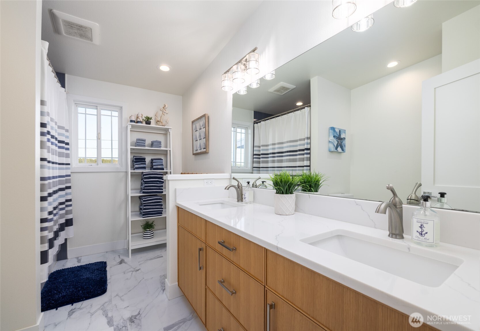2575 West Beach Road Oak Harbor, WA 98277 - Photo 36 of 40 a bathroom with a double vanity sink mirror and shower