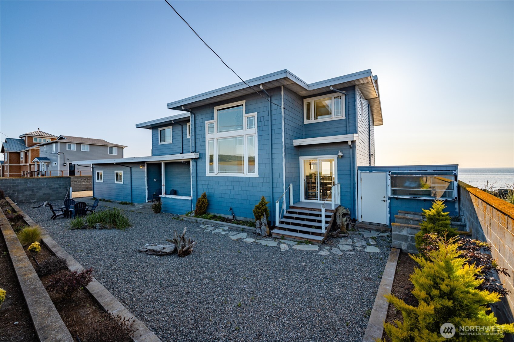 2575 West Beach Road Oak Harbor, WA 98277 - Photo 5 of 40 a front view of a house with garden