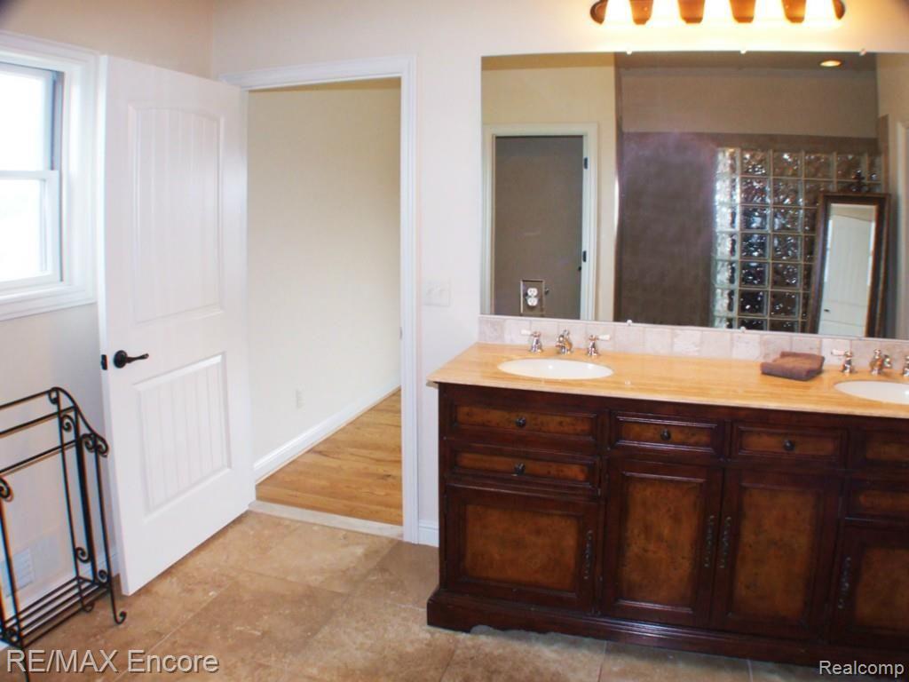 8363 Henderson Road Goodrich, MI 48438 - Photo 18 of 44 Master bath with dual sinks, beautiful vanity