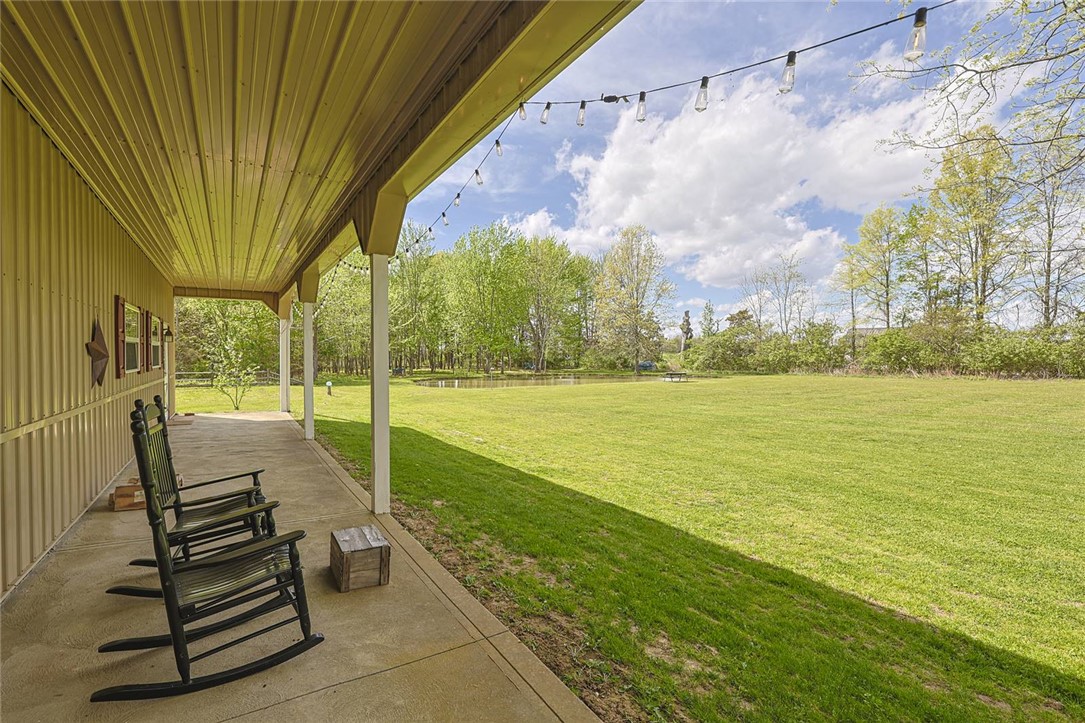 1757 Phillips Road Lebanon, OH 45036 - Photo 39 of 51 Relax on the porch and enjoy views of the expansive yard and serene pond.