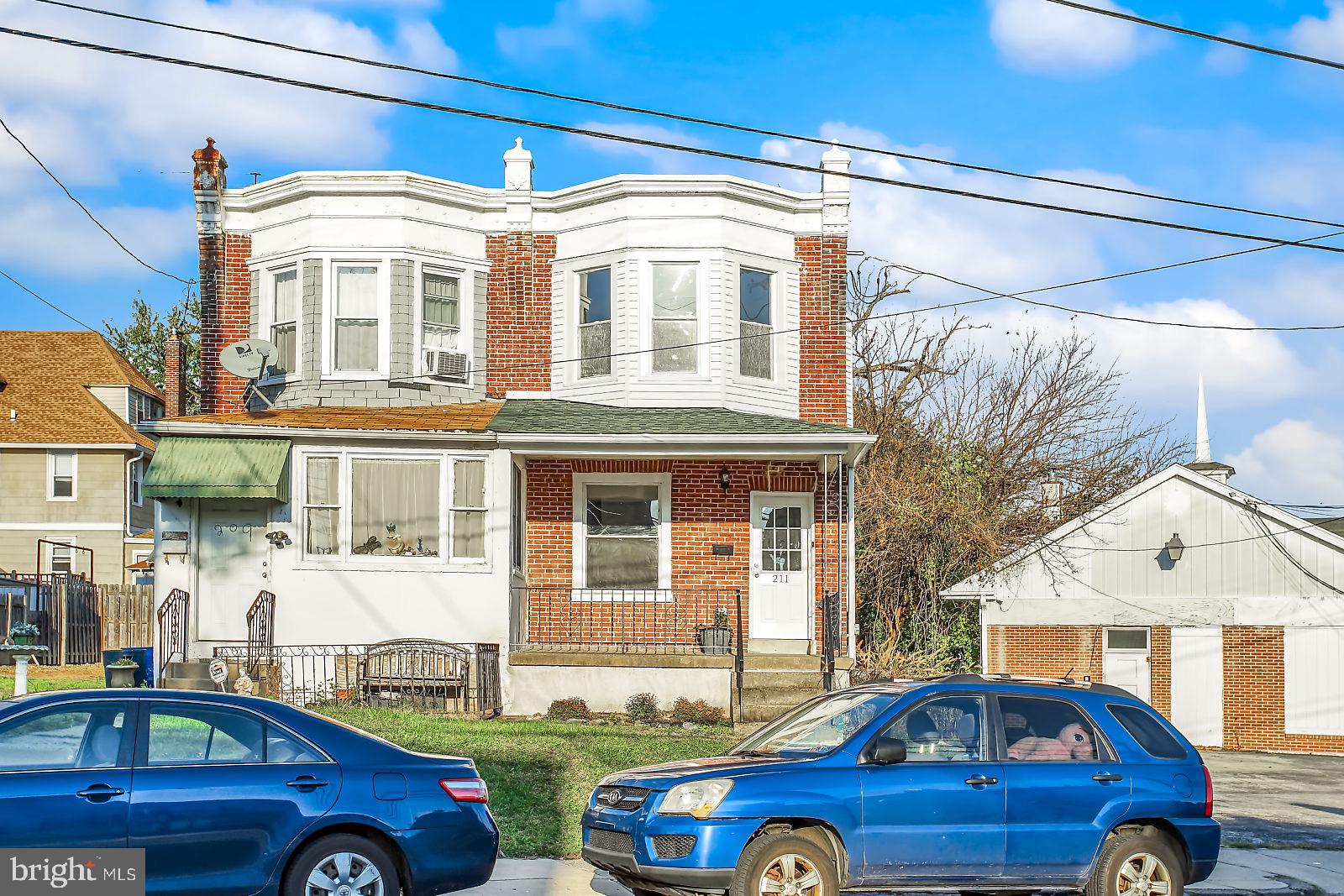 211 South Springfield Road Clifton Heights, PA 19018 - Photo 1 of 24 a front view of a house with a yard