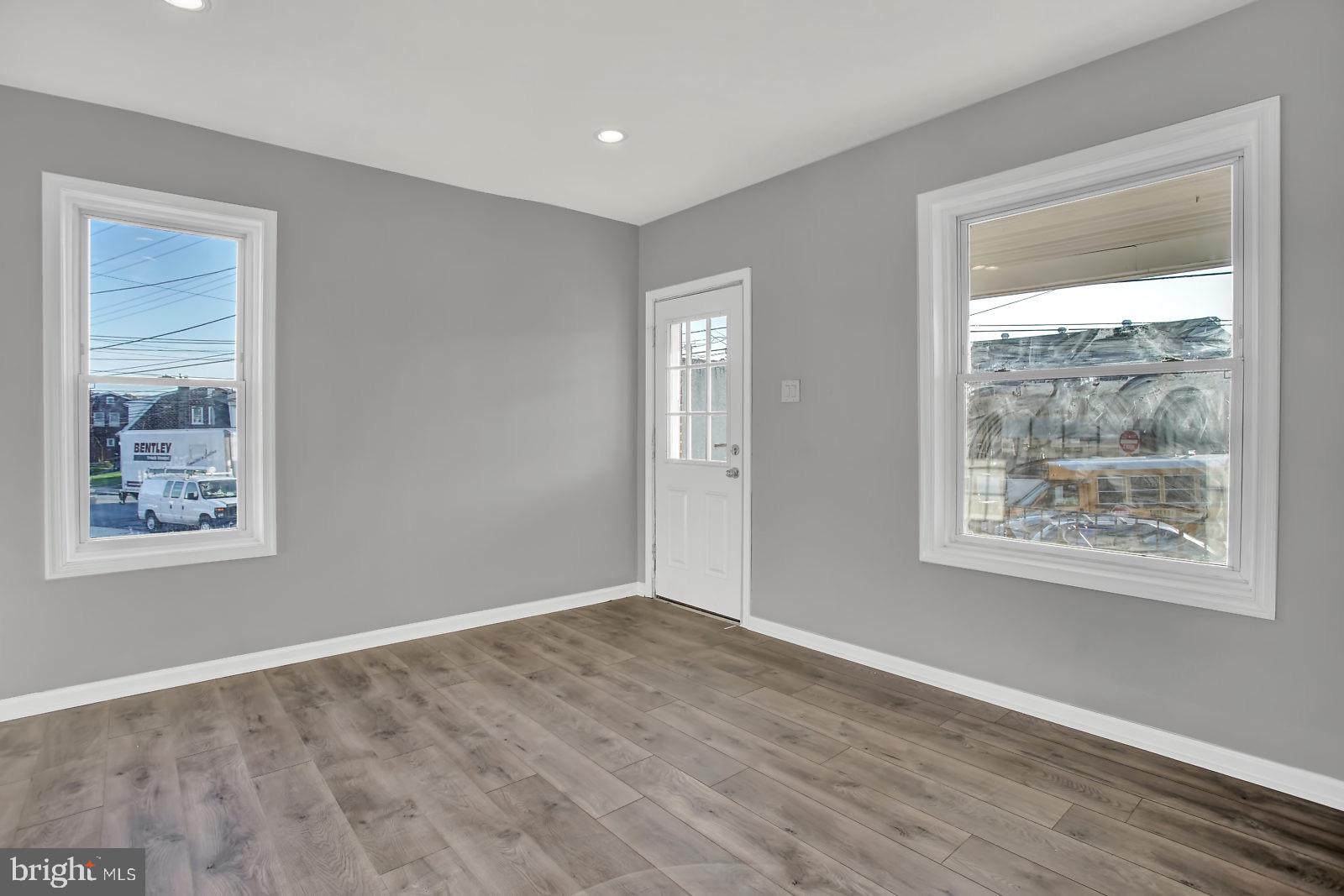 211 South Springfield Road Clifton Heights, PA 19018 - Photo 7 of 24 a view of an empty room with wooden floor and a window