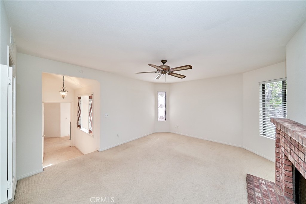 4431 Emerald Street Torrance, CA 90503 - Photo 12 of 31 a view of a big room with windows and chandelier fan