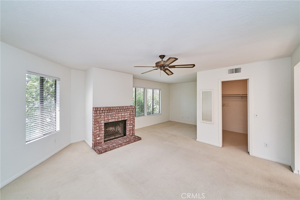 4431 Emerald Street Torrance, CA 90503 - Photo 14 of 31 a view of a livingroom with a fireplace and chandelier fan