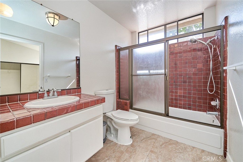 4431 Emerald Street Torrance, CA 90503 - Photo 18 of 31 a bathroom with a sink and a mirror