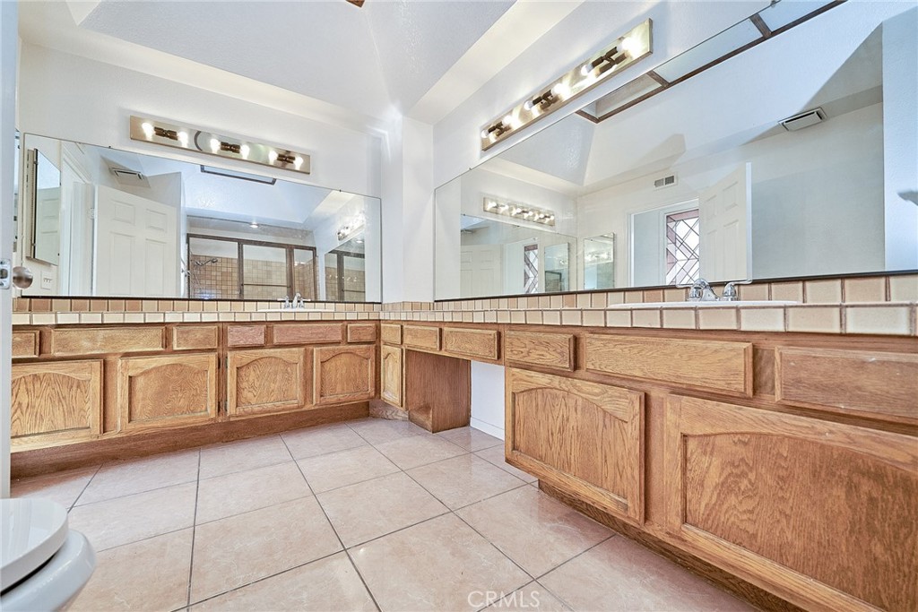 4431 Emerald Street Torrance, CA 90503 - Photo 10 of 31 a large kitchen with cabinets and a large window