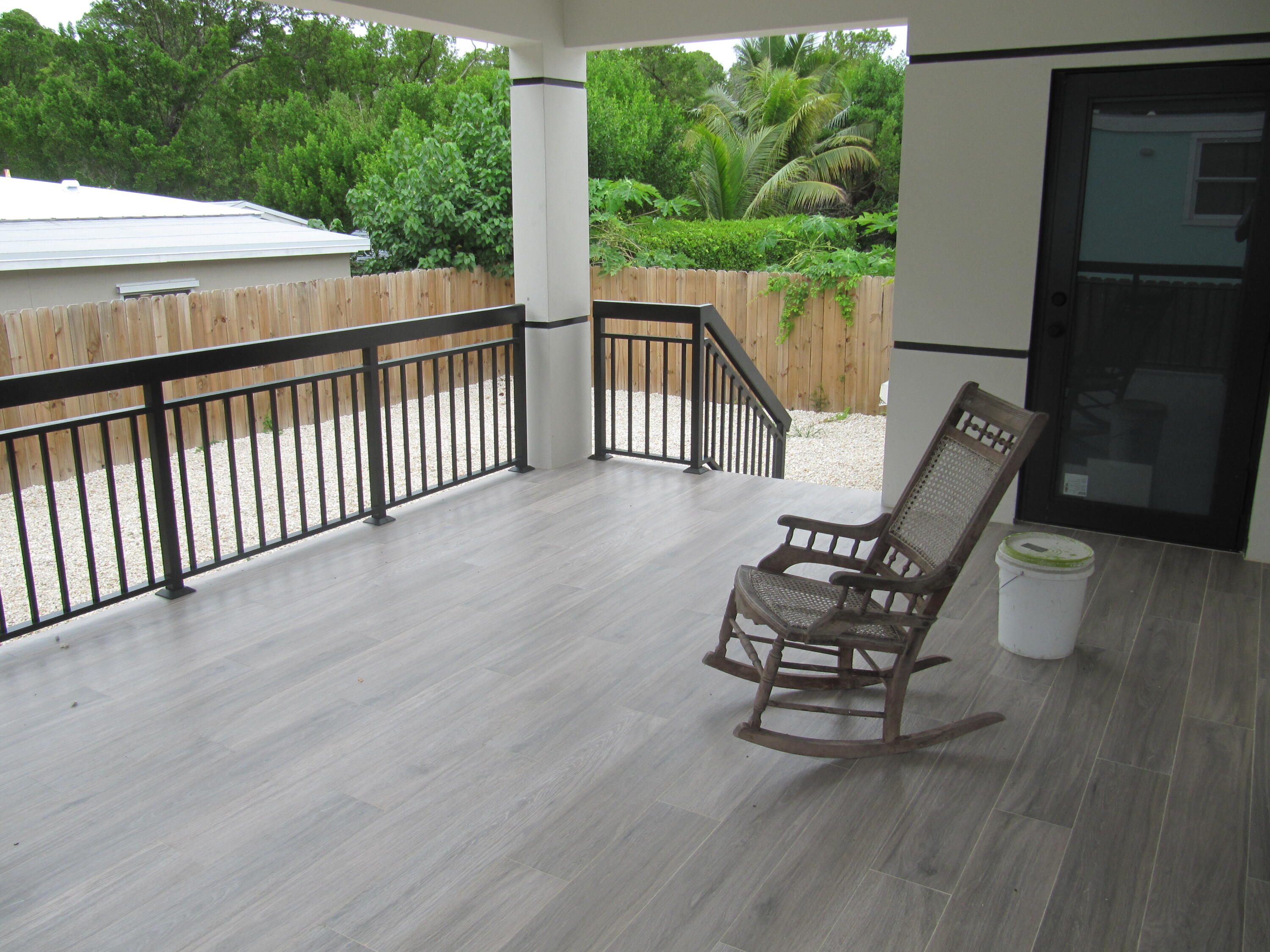 16 Tina Place Key Largo, FL 33037 - Photo 15 of 19 a view of a chair and tables in the balcony
