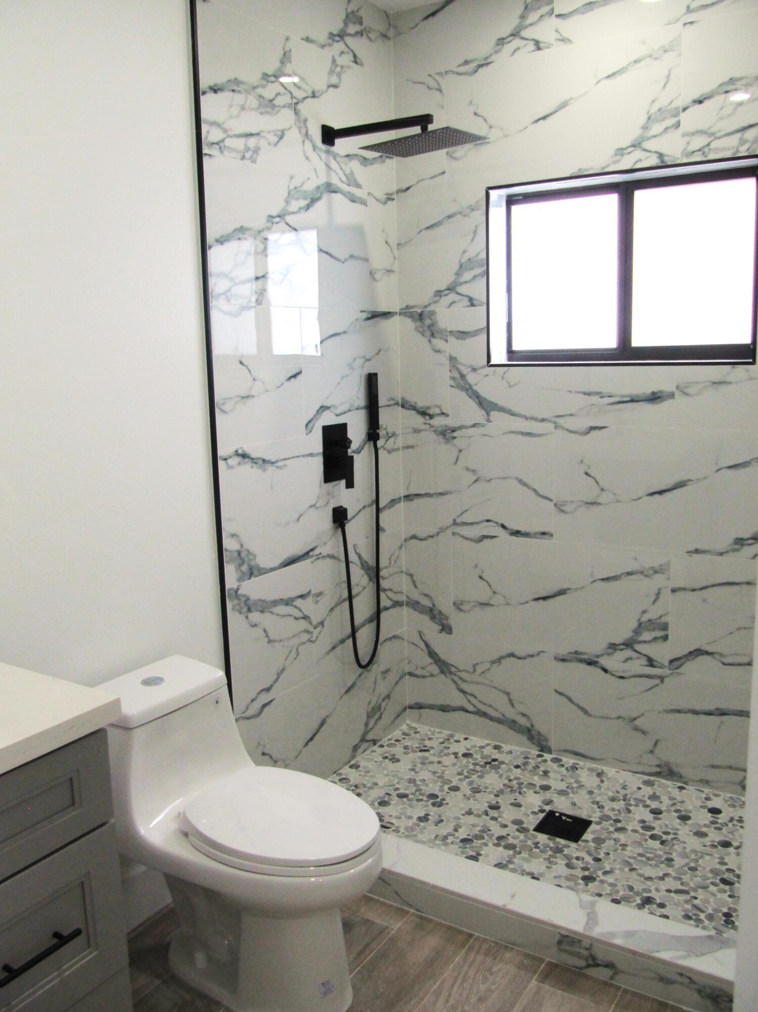 16 Tina Place Key Largo, FL 33037 - Photo 10 of 19 a bathroom with a toilet and a shower