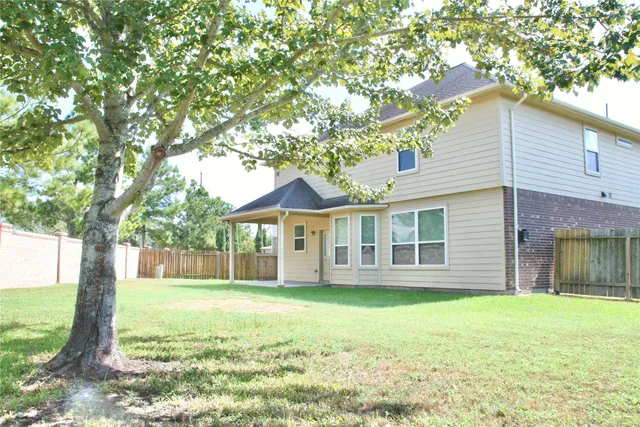 a view of backyard with green space