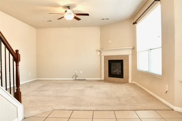 a kitchen with granite countertop a refrigerator and a sink