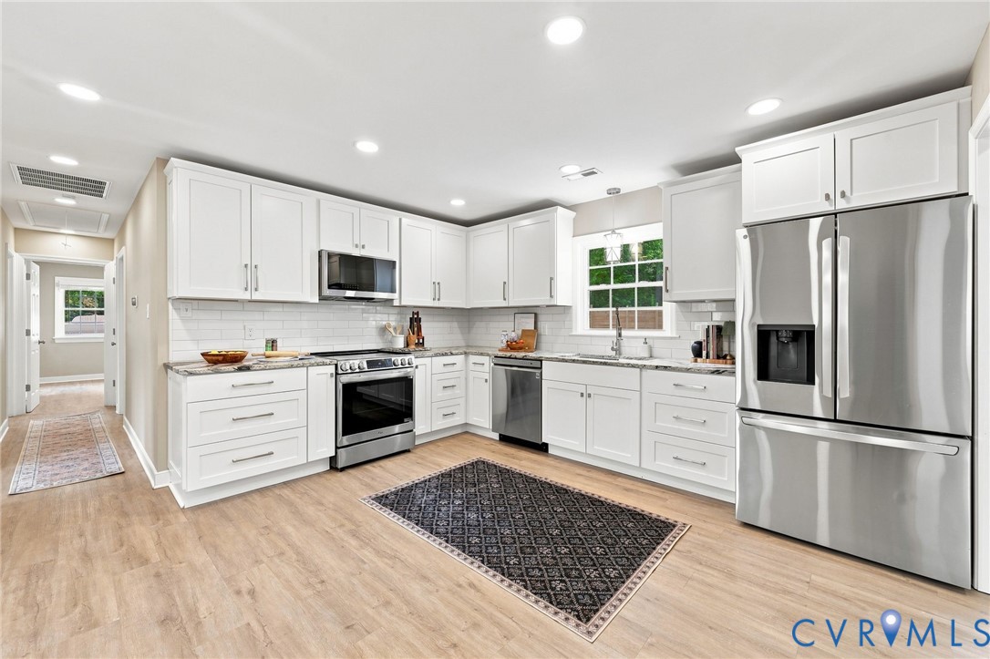 3221 Clintwood Road Midlothian, VA 23112 - Photo 21 of 46 Contemporary kitchen featuring white cabinetry, st