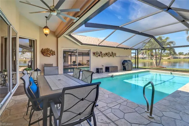 a view of a dining room with furniture and a table