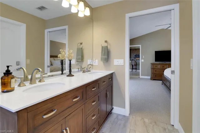 a spacious bathroom with a double vanity sink mirror and