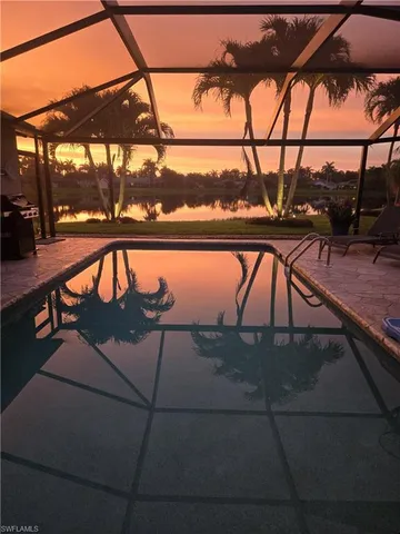 a view of swimming pool with outdoor seating