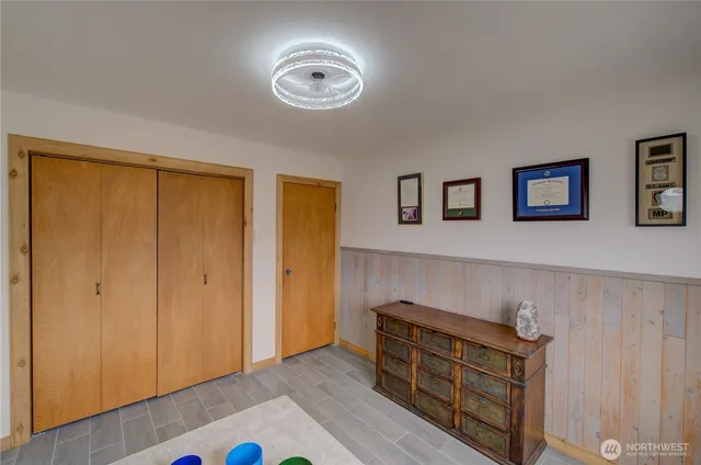 a view of room with window and wooden floor