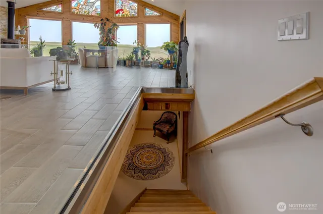 a view of entryway and hall with wooden floor
