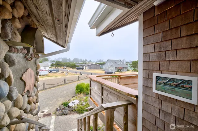 a view of a patio with a table and chairs